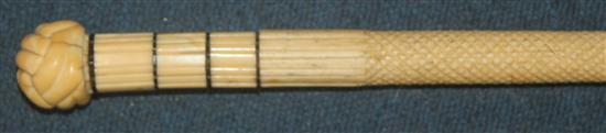 A 19th century scrimshaw carved whale bone and baleen walking cane, 39in.